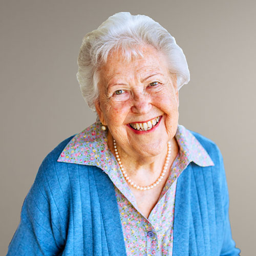 Smiling senior woman representing daily living assistance, non-medical in-home senior support, and independence in everyday routines