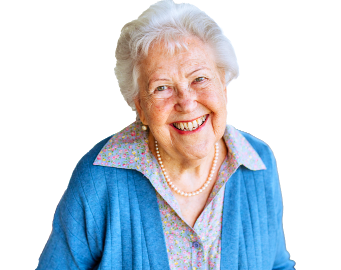 Smiling older woman wearing a cardigan and necklace