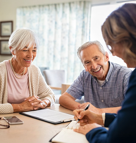 Older couple meeting with an AgeSMART care advisor to begin a personalized in-home senior care plan with clear next steps