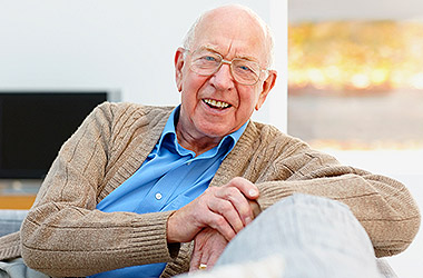 Smiling senior man living confidently and comfortably at home