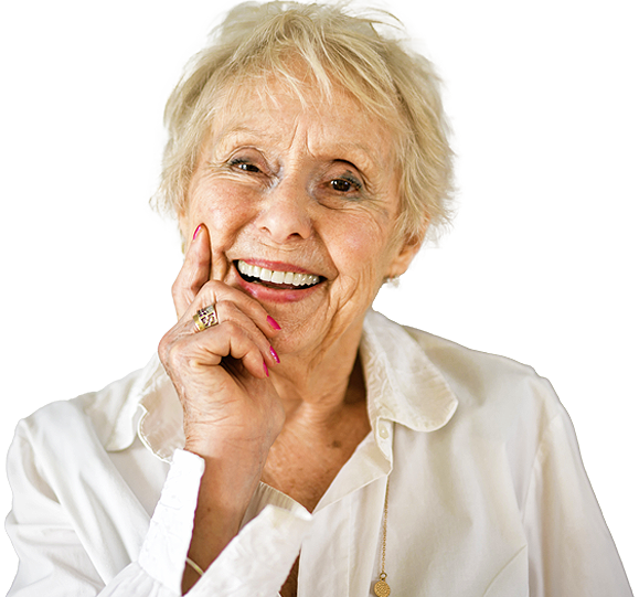 smiling older woman with short gray hair wearing white blouse